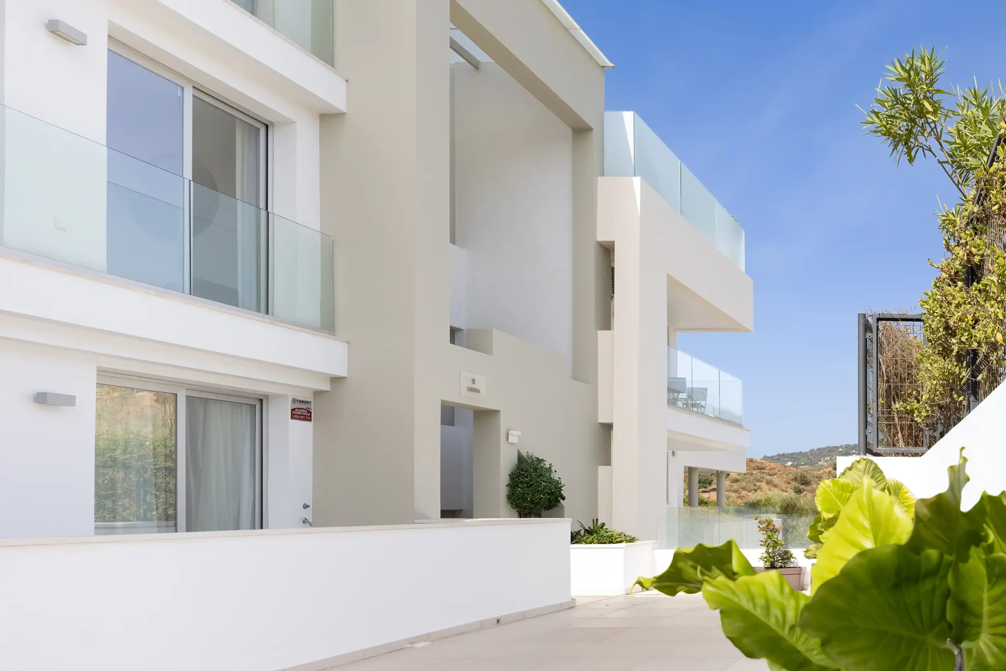 Rear view of the apartments, with access to the lifts and stairways connecting the different areas of the development.